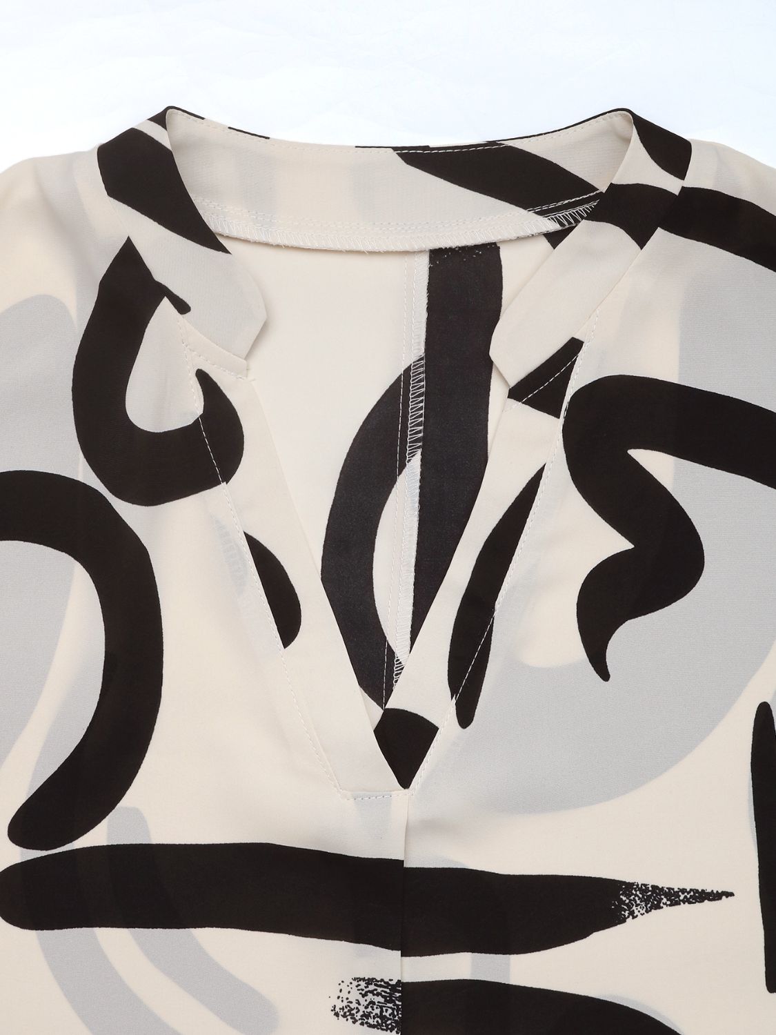 Perfee Printed Notched Half Sleeve Blouse - Classique Collection